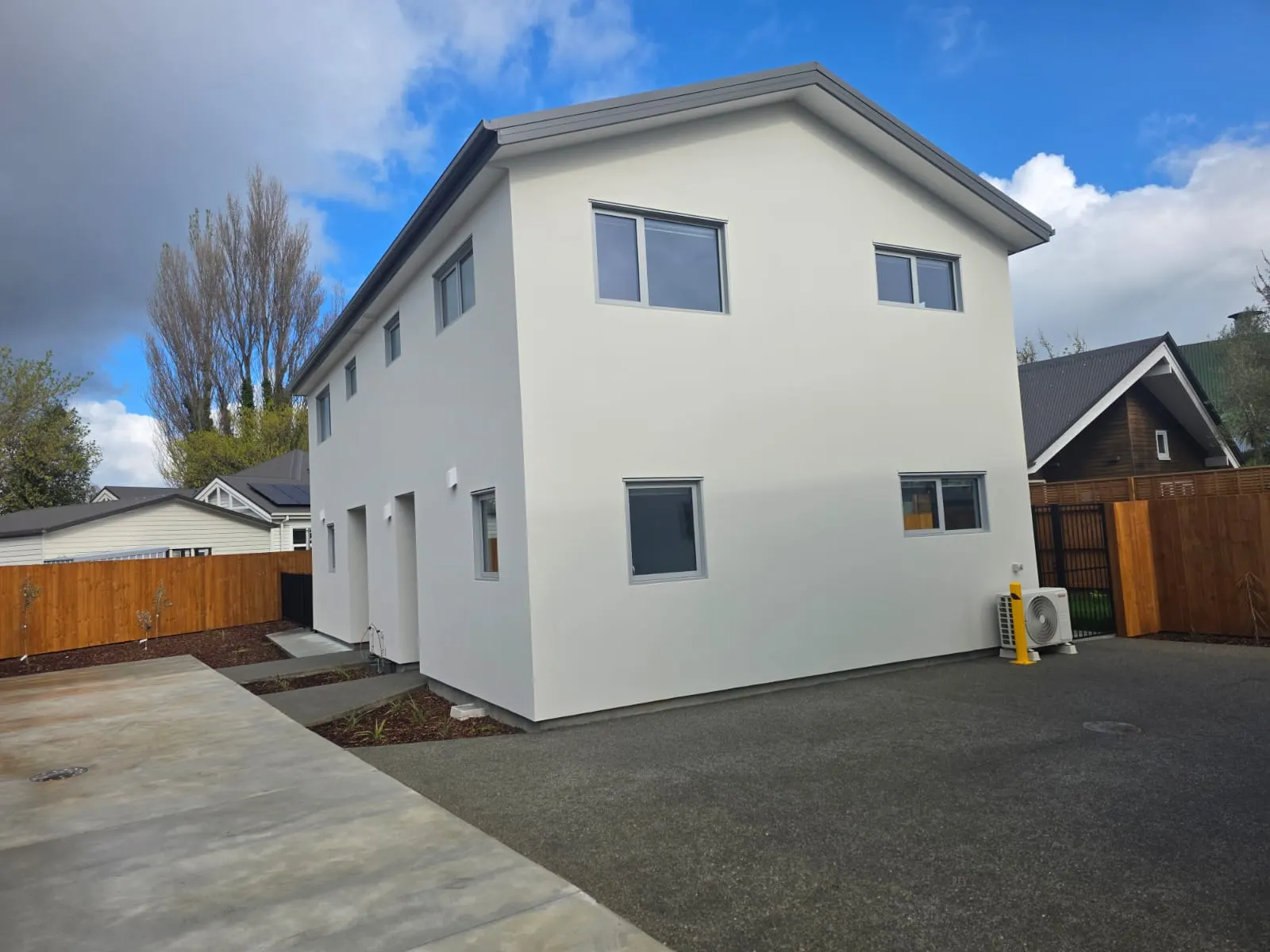 Two-storey house with flawless white exterior plaster finish